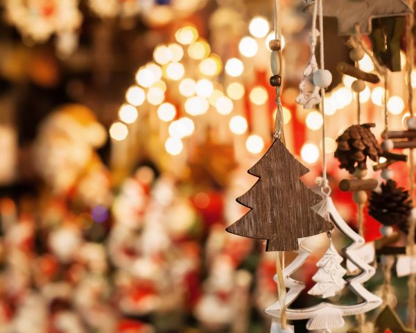 Image of hanging Christmas tree decoration being sold at a market stall.