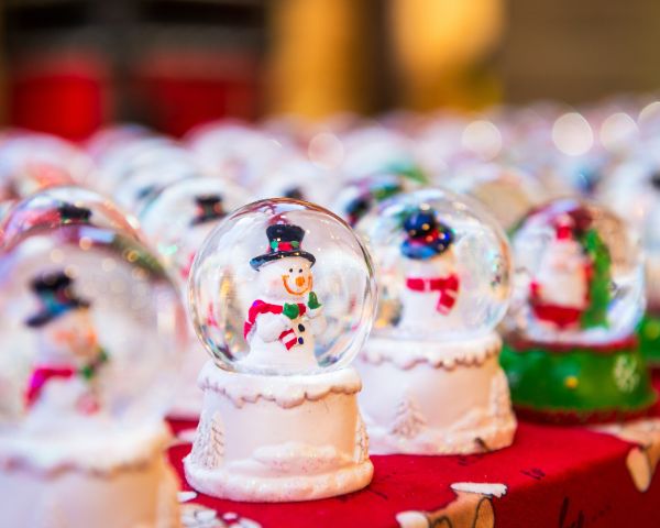 Image of snowglobe at a Christmas market stall with a snowman inside
