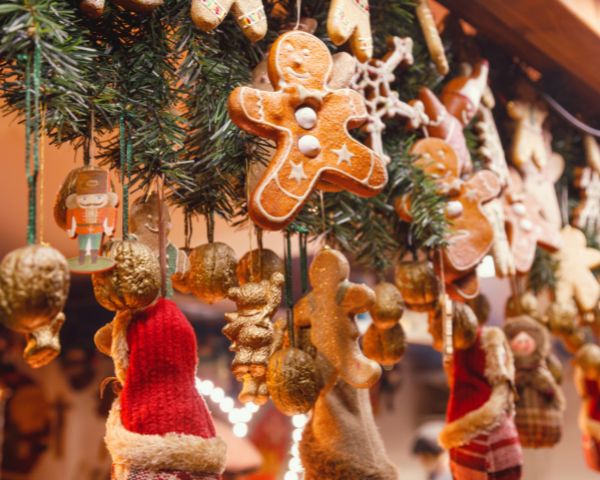 Image of a hanging gingerbread man decoration at a market stall.